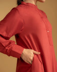 A maroon cotton kurta with a band collar, styled for a casual, elegant look.
