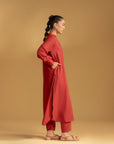 A versatile maroon women's kurta perfect for pairing with trousers or leggings for a traditional outfit.