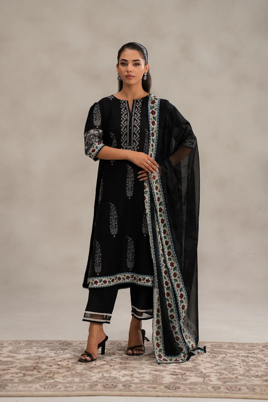 Black 2-piece unstitched lawn suit with digital printed shirt front, back, sleeves, and chiffon dupatta – premium ladies unstitched lawn suits online in Pakistan.