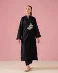 Black co ord set for women in Pakistan featuring embroidered lawn kurta with band collar and matching black trousers