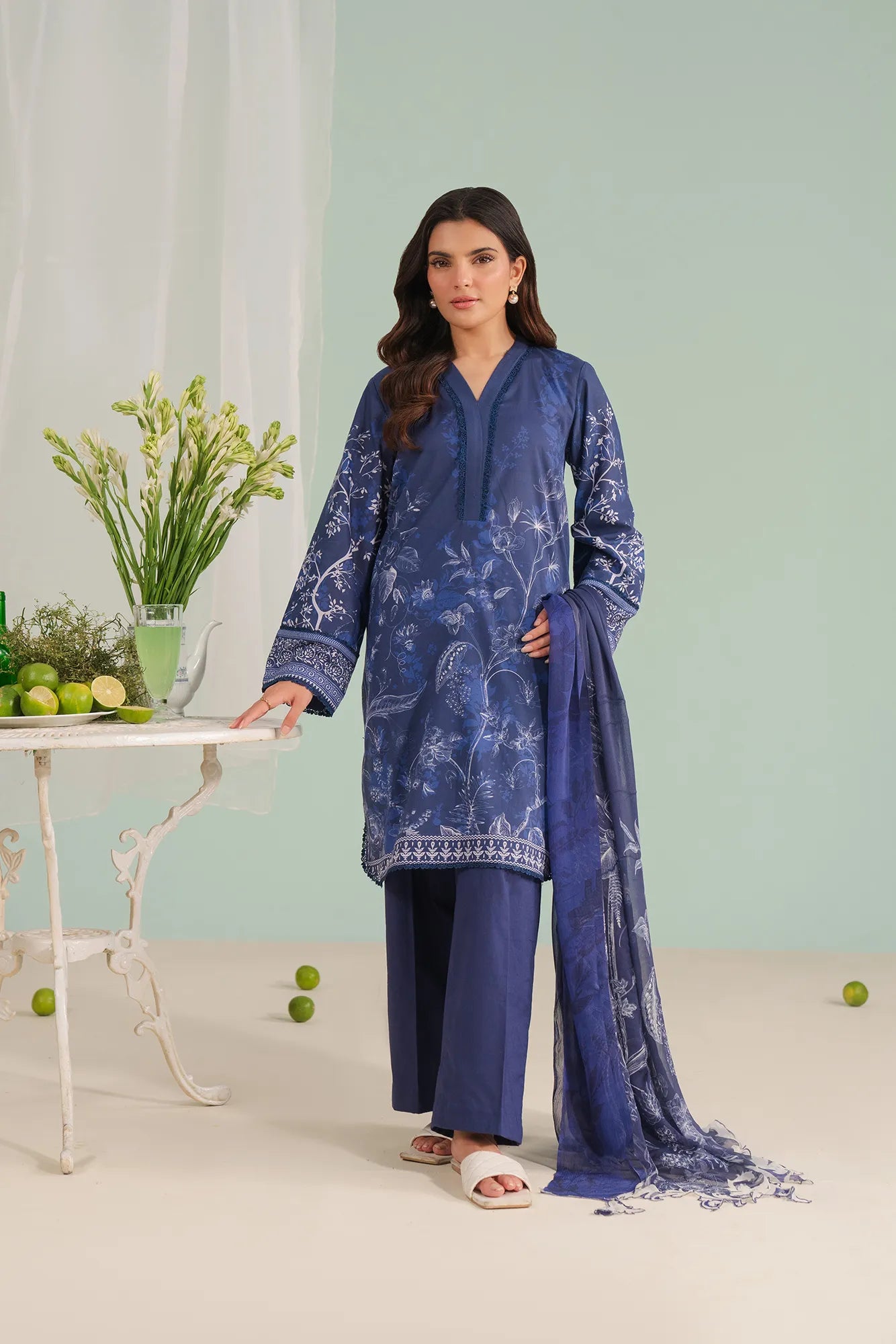 Blue 3-piece unstitched lawn suit for women – digital printed shirt with cambric trouser and chiffon dupatta, premium summer lawn fashion Pakistan.