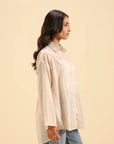 Buy beige cambric embroidered shirt for women – stylish and breathable fabric.