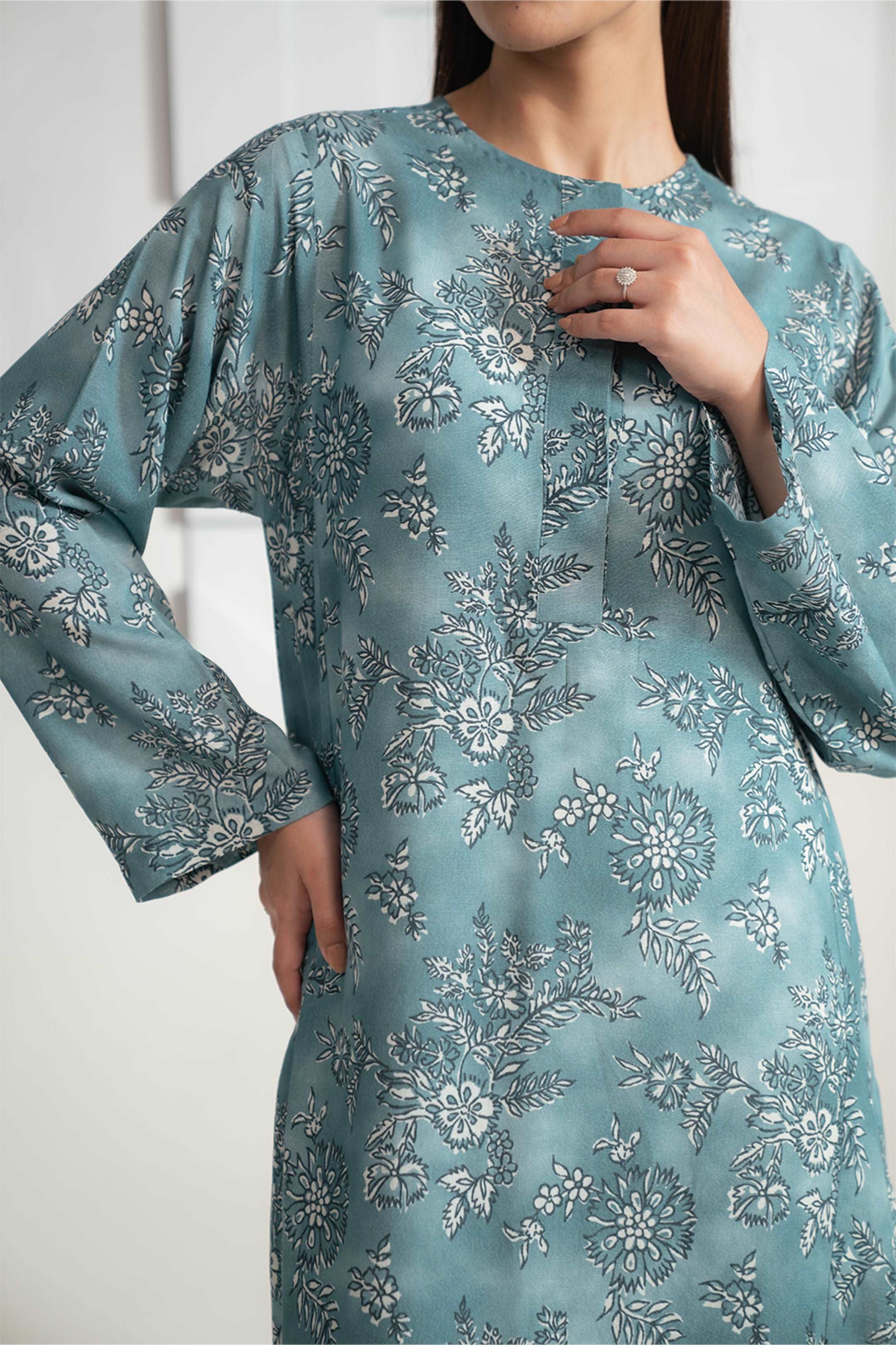 Buy this 1-piece ladies’ floral Karandi shirt with a teal base online,  perfect for any outing