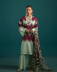 Chic apple green lawn suit with bold maroon ikkat prints, paired with a modern abstract chiffon dupatta – a statement look for summer fashion.