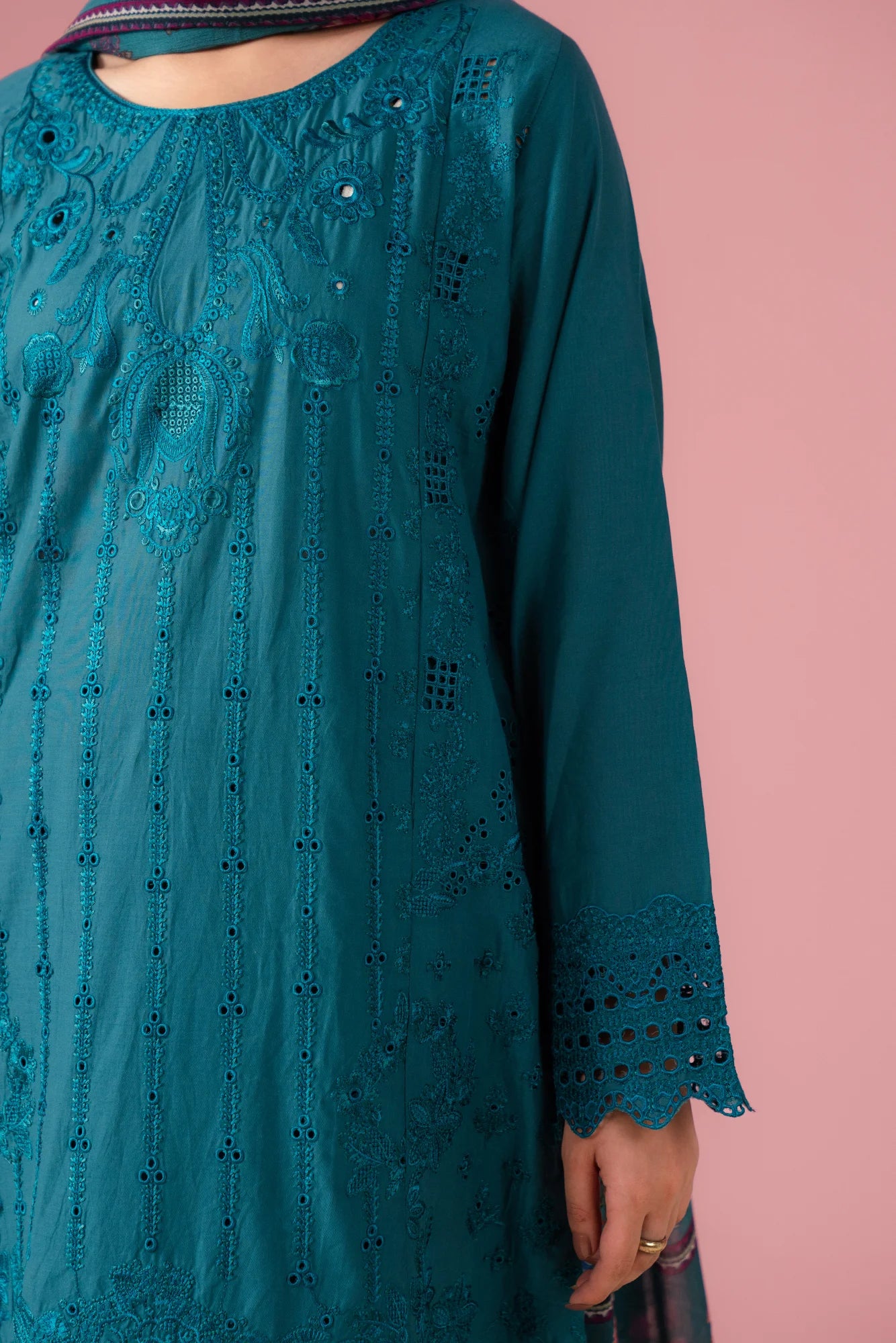 Chic teal lawn suit with detailed embroidery on front, hem, and sleeves, completed with matching trousers and silk dupatta, designed for women in Gujrat's DHA Phase I
