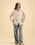 Classic off-white button-down shirt – versatile casual and formal wear for women.