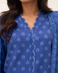Close-up of blue printed linen shirt fabric and neckline detail