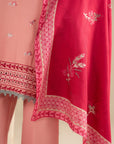 Close-up of embroidery detailing on light pink khaddar shirt for winter wear