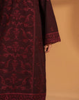 Close-up of embroidery pattern on maroon khaddar fabric