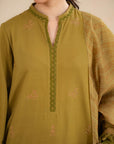 Close-up of olive green embroidered fabric with lace trim