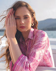 Close-up portrait of pink printed silk shirt with soft feminine print