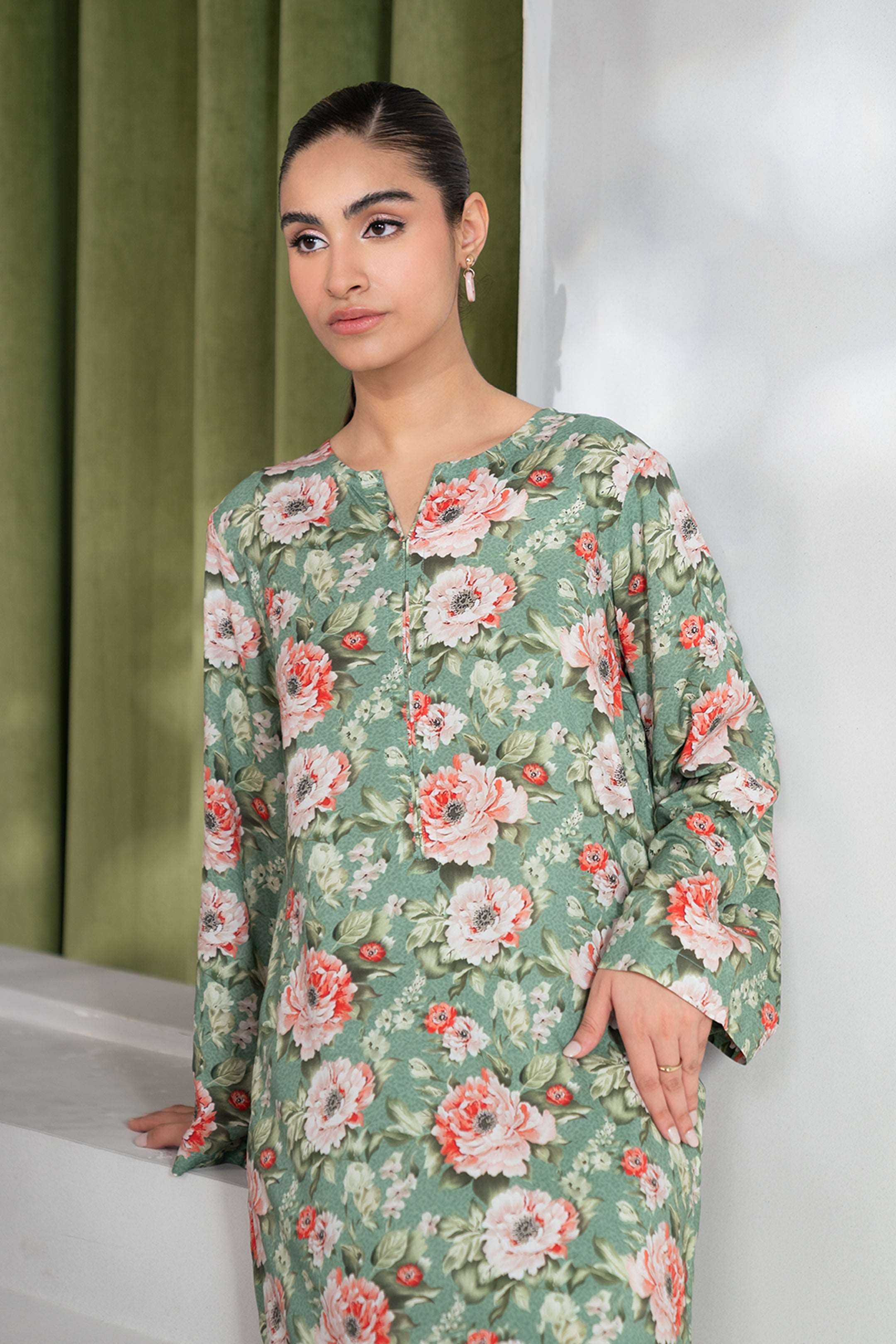 Comfort meets elegance with this 2-piece green printed linen suit, available to shop online