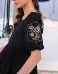 Gold embroidery detail on sleeve of black cambric frock - Beyond East women's pret