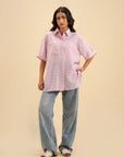 Elegant pink button-down shirt – a versatile wardrobe essential for women.