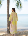 Full-length beachside view of printed lawn kaftan