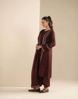Full-length side view of maroon raw silk pret suit showing straight silhouette and matching bottom.