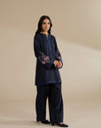 Full-length view of navy blue kurta and trouser set, relaxed fit silhouette.