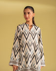 Latest design digital print linen suit, featuring a unique geometric ikat pattern in off-white, black, and blue, available online in Islamabad
