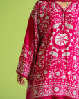 Latest designer unstitched pink linen suit with white print, perfect for Eid and festive occasions in Pakistan