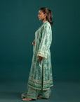Latest lawn suits in Pakistan – a beautifully printed sea green three-piece outfit with a matching monark dupatta and cambric trousers.
