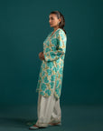 Latest lawn suits in Pakistan – a refreshing off-white and turquoise blue printed lawn shirt with matching chiffon dupatta, ideal for effortless style.