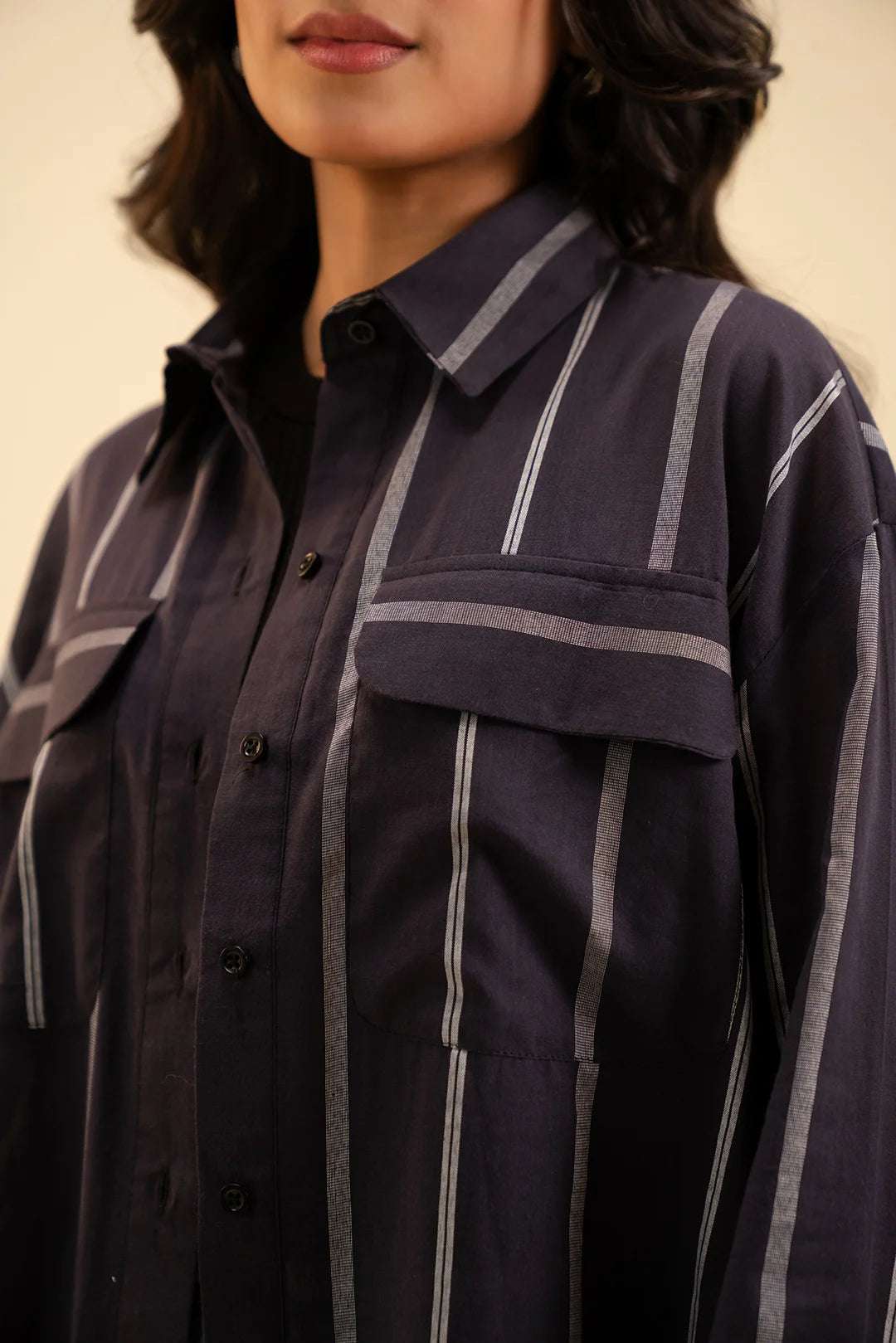 Latest women's fashion – black mid-length button-down shirt for everyday wear.