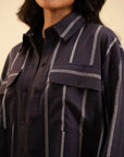 Latest women's fashion – black mid-length button-down shirt for everyday wear.