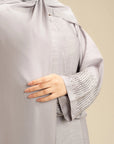 Light grey abaya design detail – simple embellished ladies abaya Beyond East