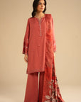 Light orange embroidered linen kurta set styled with a printed shawl, shown in a clean studio look.