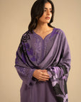 Model styled in light purple embroidered linen suit with printed shawl draped over shoulders, front pose