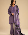 Model wearing light purple 3 piece embroidered linen suit with printed shawl, full front view in studio setting