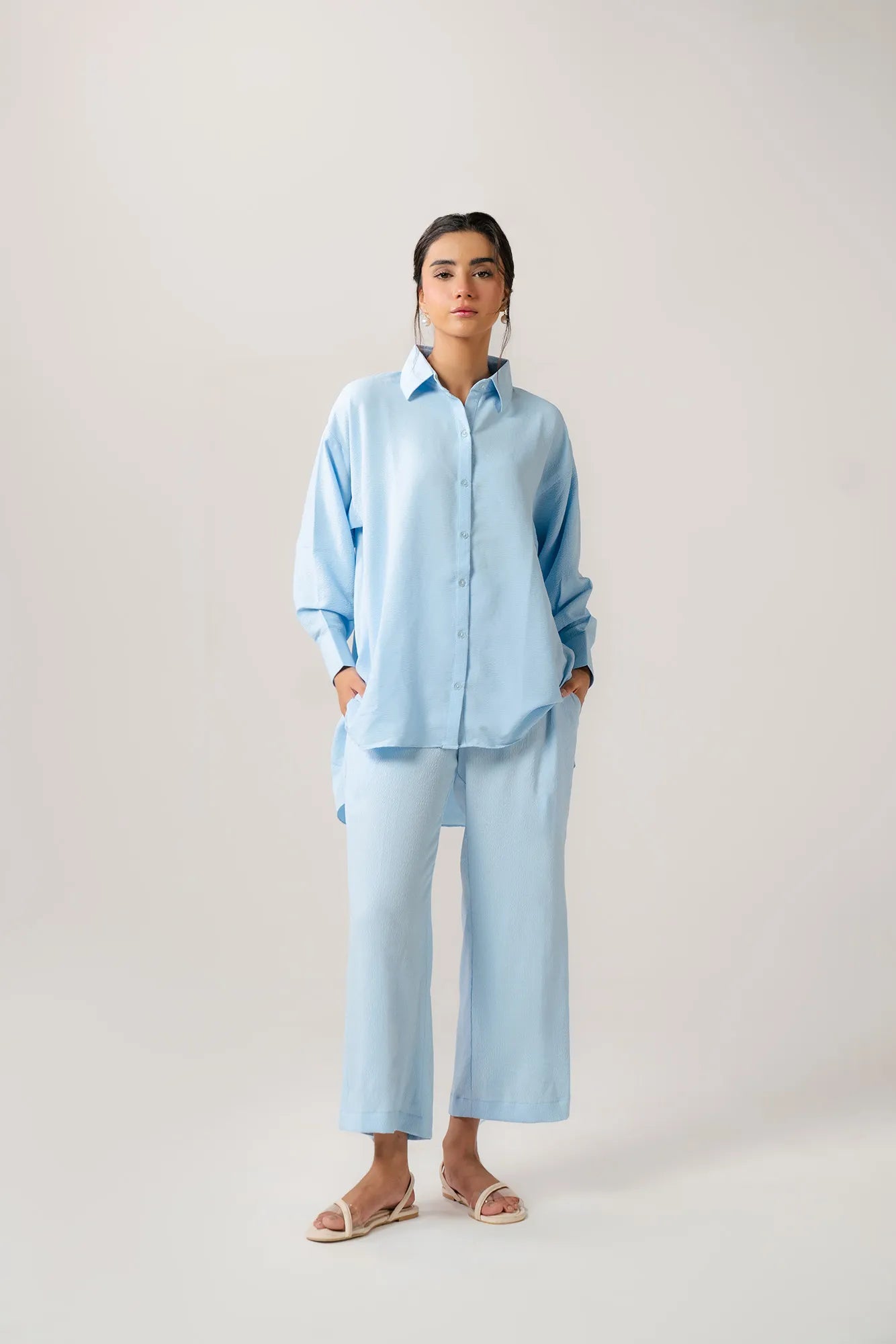 Oversized light blue ladies poplin shirt, a classic button-down with a crisp, relaxed fit.
