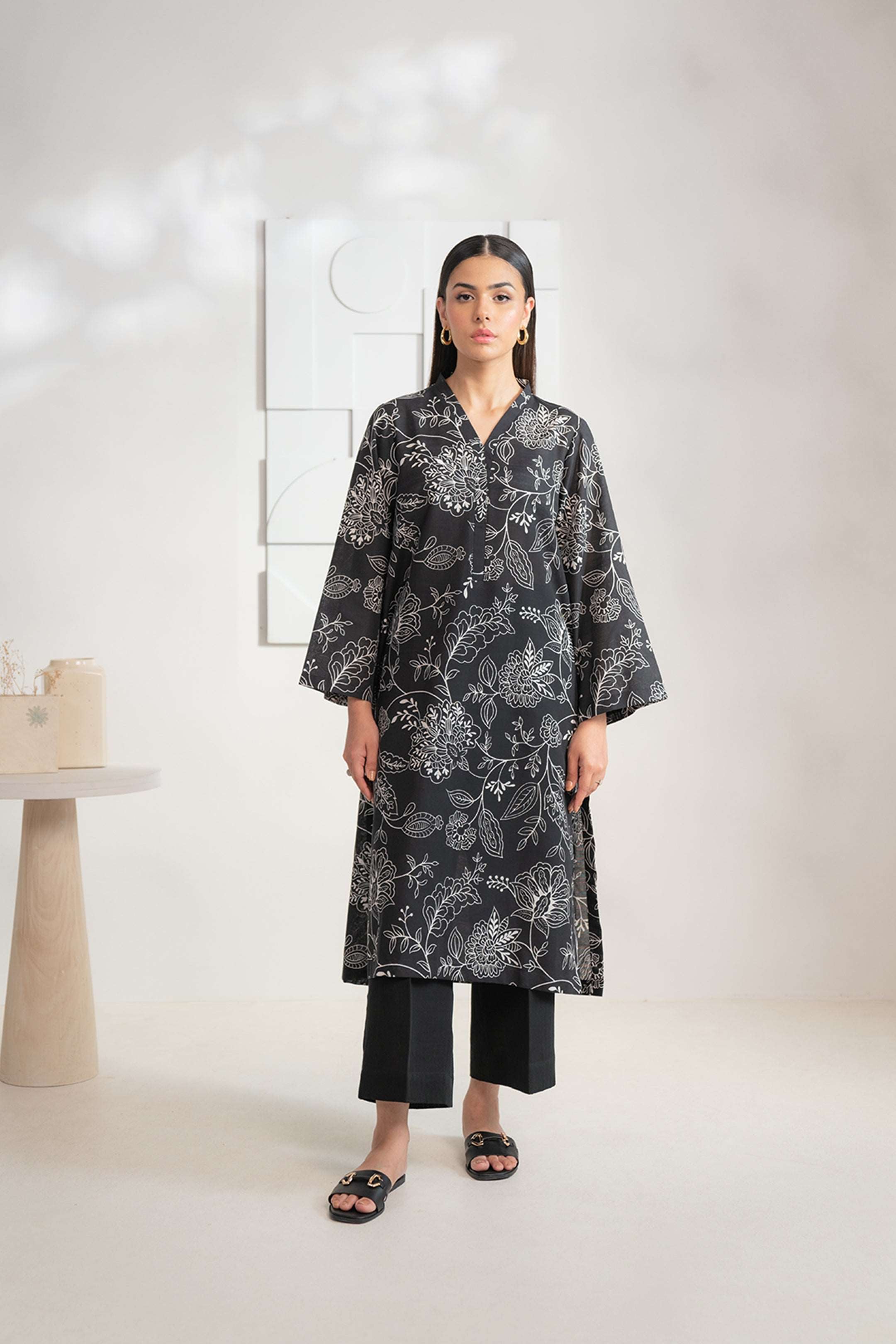 Shop this graceful black and white Karandi shirt for women online, a contemporary 1-piece outfit