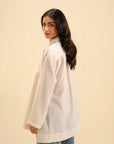 Shop trendy oversized button-up shirt – effortless style in neutral tones.