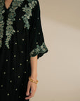 Side angle showing the kaftan’s drape and straight fall from shoulder to hem.