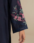 Side close-up of embroidered sleeve on navy blue kurta with floral motifs.