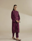 Side pose of embroidered khaddar shirt with matching trousers in deep pink tone.