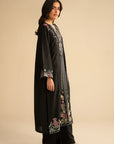 Side view of black embroidered linen suit showing flowy silhouette and dupatta drape