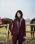 Side view of knee-length maroon coat showing straight silhouette and drape