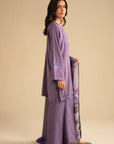 Side view of light purple embroidered linen suit showing straight trousers and relaxed kurta silhouette