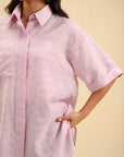 Stylish pink button-down top – perfect for office wear and weekend outings.