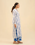 Stylish white and blue printed shirt with ikat pants – trendy summer wear.
