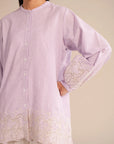 Trendy casual shirt for women featuring embroidery on sleeves and hemline