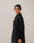 Trendy long sleeve black shirt for women in modern minimalist style