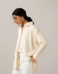 Trendy oversized button-down women western shirt paired with white jeans