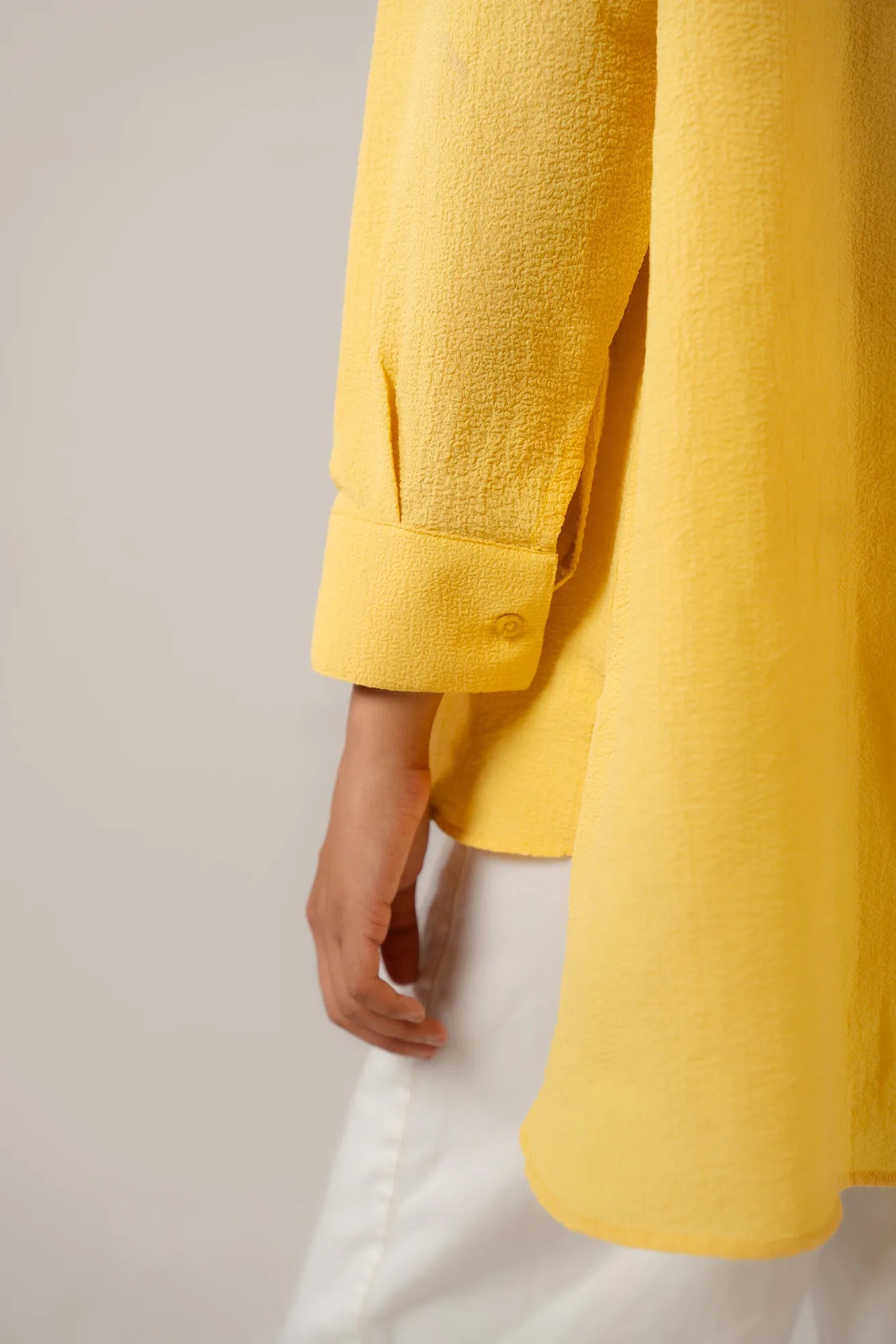 Trendy yellow oversized shirt women - casual button down blouse with rolled sleeves styling