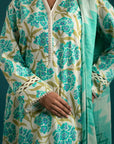 Upgrade your wardrobe with this stylish unstitched lawn suit – a soft off-white and aqua floral ensemble with a striking chiffon dupatta.