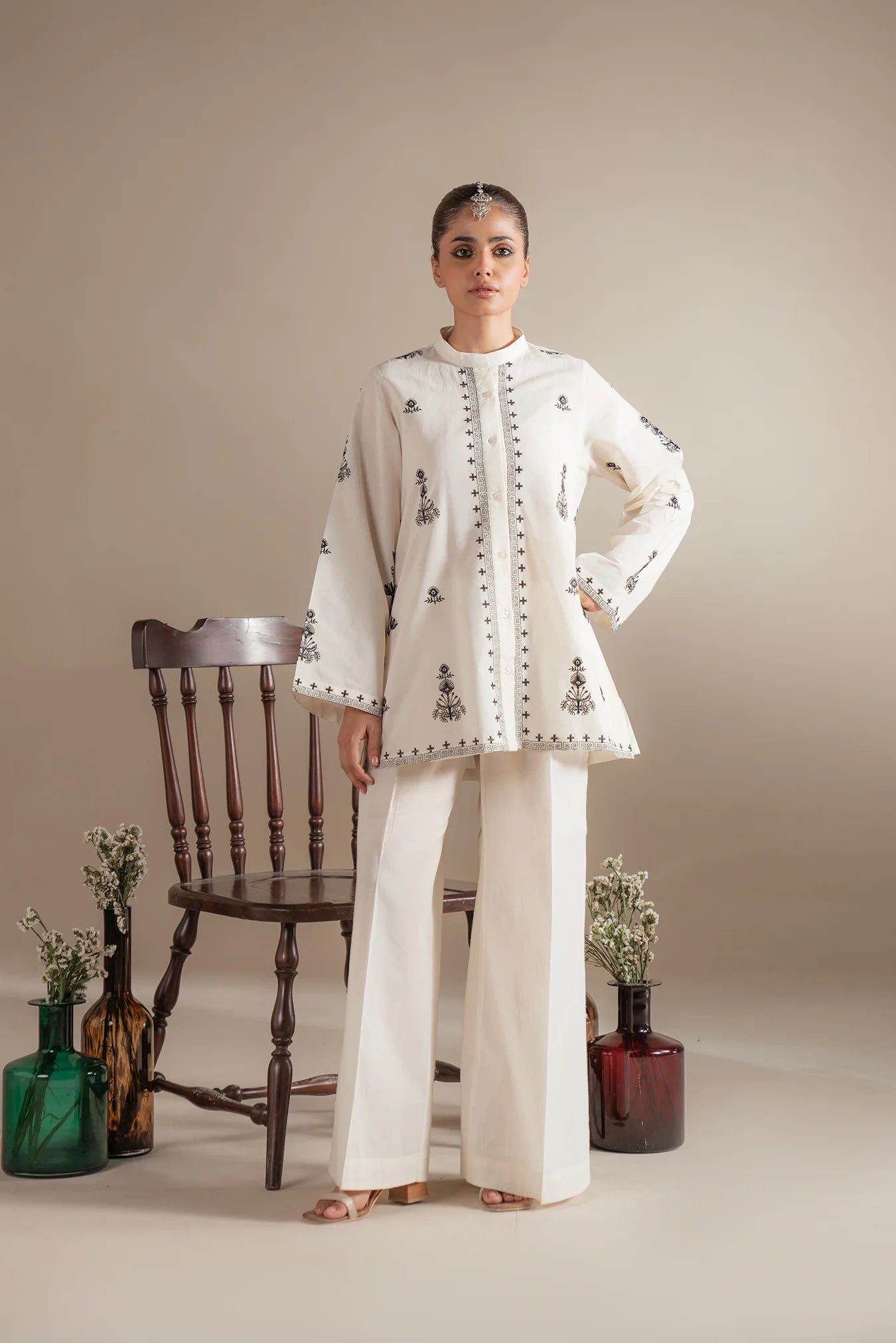 Where to buy elegant white monochrome outfits with black embroidery for Muharram