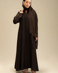 Woman wearing dark brown full-length abaya – graceful modest fashion Beyond East
