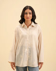 Women's embroidered cambric button-down shirt – casual and chic fashion choice.